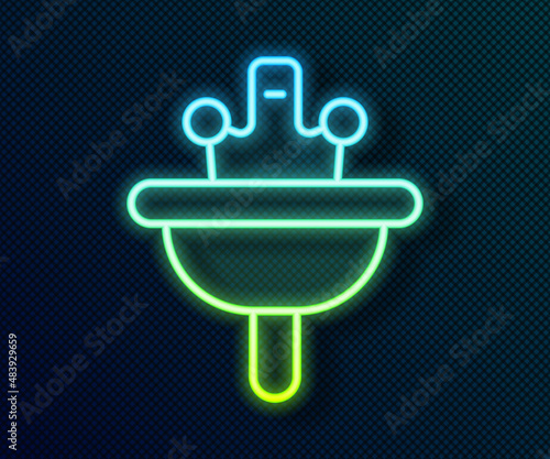 Glowing neon line Washbasin with water tap icon isolated on black background. Vector