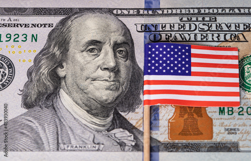 U.S. 100 dollar banknote on american flag background