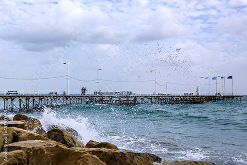 Pier with stormy winter sea and cloudy sky  Limassol  Cyprus