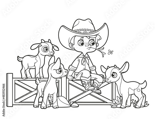 Cute cartoon boy cowboy in hat sits on the fence and looks at the goatlings nearby outlined for coloring page on white background