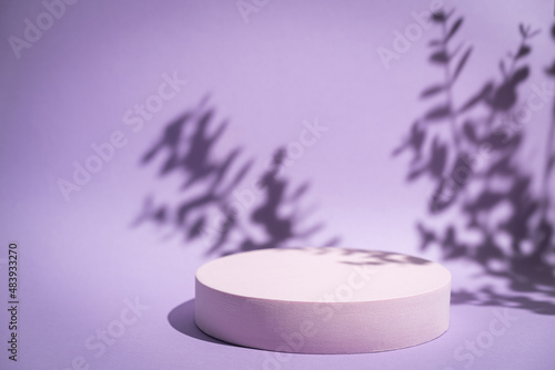 Abstract minimalistic scene with geometric forms. podium on purple background with shadows. product presentation, mock up, show cosmetic product display, Podium, stage pedestal or platform.