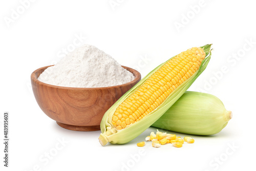 Corn starch in wooden bowl with fresh corn isolated on white background.