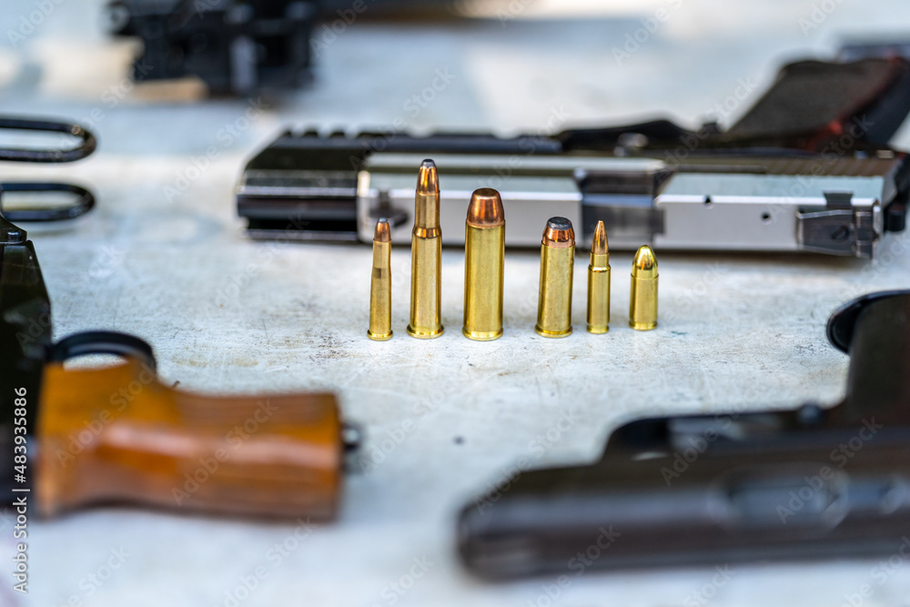 pistols and bullets on the table pistols and bullets on the table