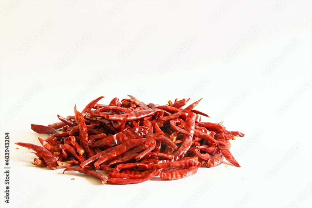 Fototapeta premium Dried red chili peppers. stock photo isolate on white front view copy space 