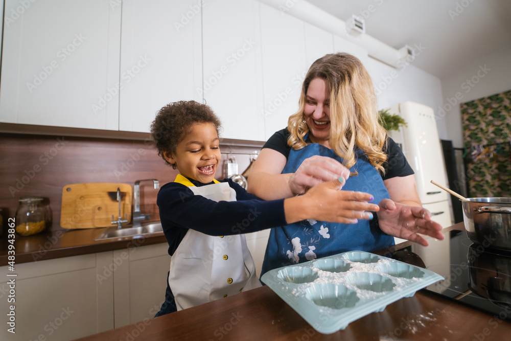 Mom and daughter prepare a baking dish Mom and daughter prepare a baking dish