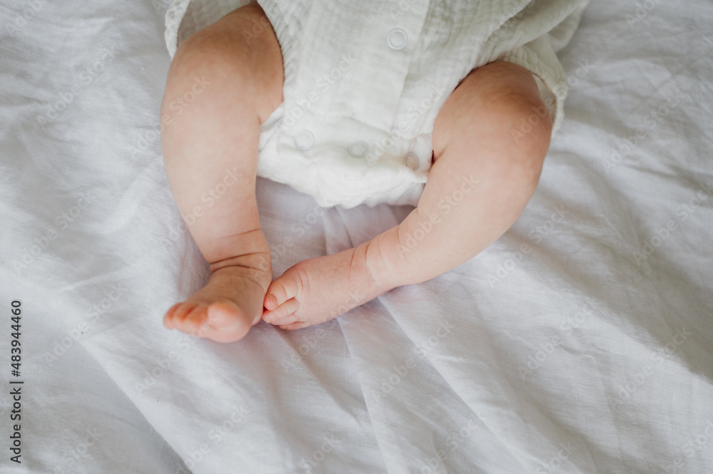 Legs of a newborn. Close-up photo. Legs of a newborn. Close-up photo.