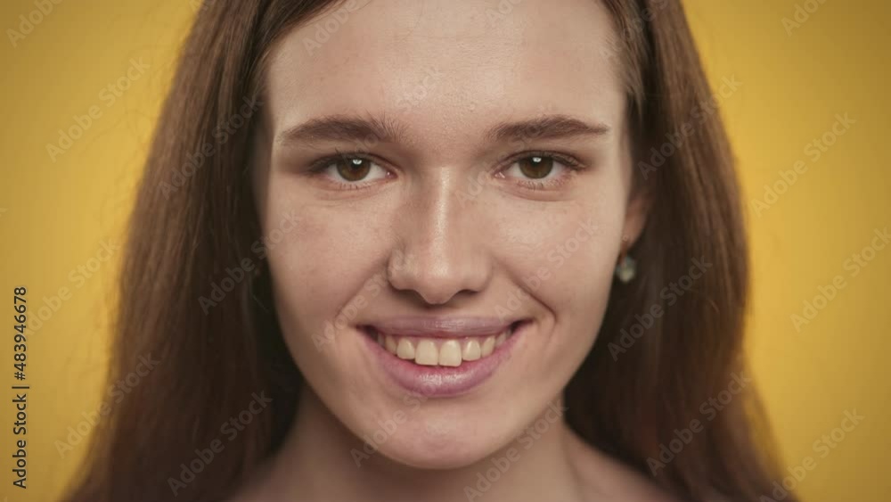 Extreme close up of a smiling caucasian young adult woman Extreme close up of a smiling caucasian young adult woman
