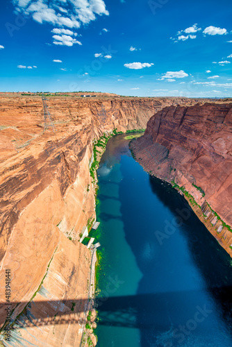 Lake Powell and Glen Canyon Dam in the Desert of Arizona under a blue summer sky, USA