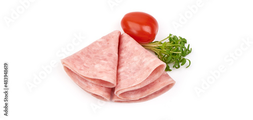 Twisted salami slices, isolated on white background.