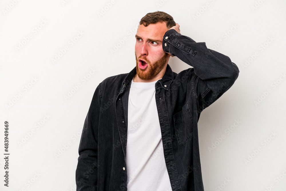 Young caucasian man isolated on white background being shocked, she has remembered important meeting. Young caucasian man isolated on white background being shocked, she has remembered important meeting.