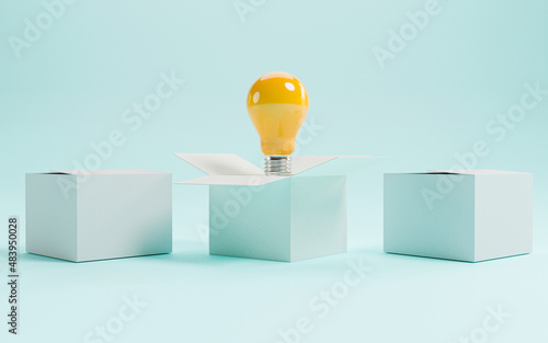 Yellow lightbulb inside of open white box between two close boxes on blue background for creative thinking idea concept by 3d render.