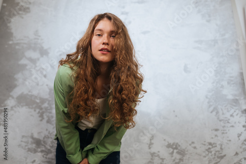 Pretty female looking at camera. Studio shot of beautiful woman.