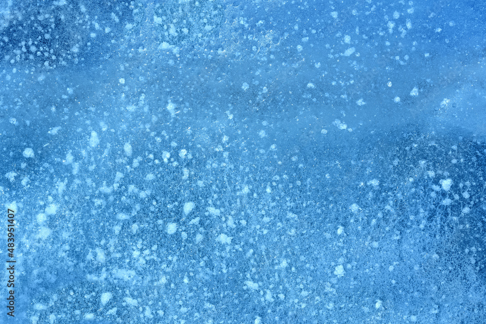 The texture of dark blue ice on the surface of the river. Ice pattern as a background.