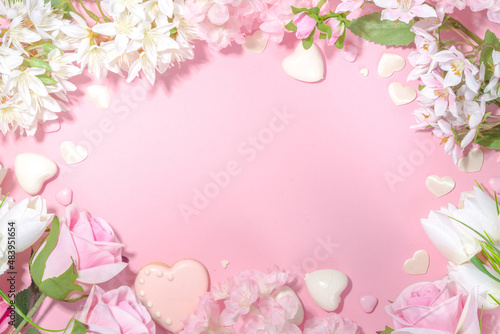 Pink and white spring holiday background with various cute tender flowers. Valentine day, international women's day 8 march, birthday, mother's day greeting card mockup top view flatlay frame