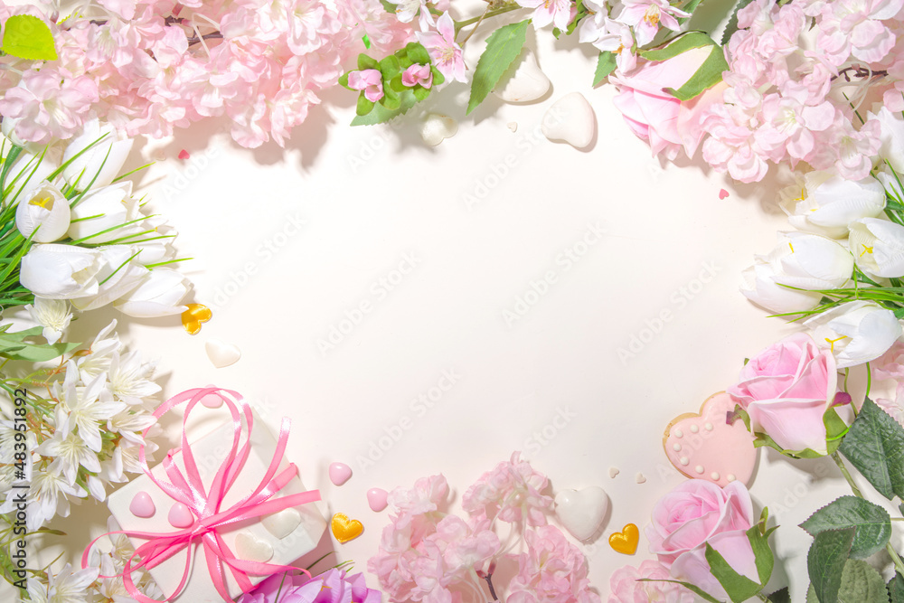 Pink and white spring holiday background with various cute tender flowers. Valentine day, international women's day 8 march, birthday, mother's day greeting card mockup top view flatlay frame Pink and white spring holiday background with various cute tender flowers. Valentine day, international women's day 8 march, birthday, mother's day greeting card mockup top view flatlay frame