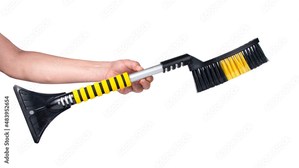 Winter car brush for removing snow plastic scrapper isolated on the white Winter car brush for removing snow plastic scrapper isolated on the white