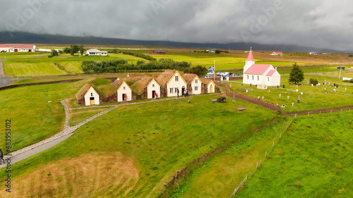 Aerial view of Glaumbaer, Iceland. Glaumbaer, in the Skagafjordur district in North Iceland, is a museum featuring a renovated turf farm and timber buildings. photo