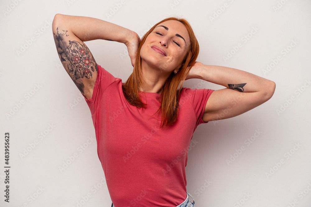 Young caucasian woman isolated on white background feeling confident, with hands behind the head. Young caucasian woman isolated on white background feeling confident, with hands behind the head.