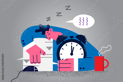 Tired businessman fall asleep at office desk 