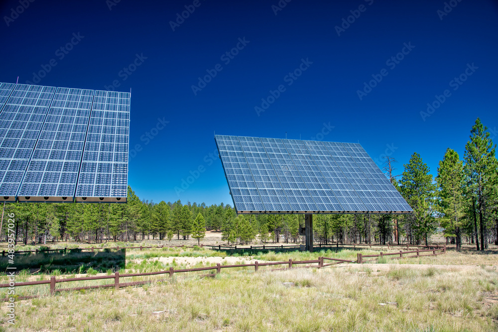 Solar panels under a blue summer sky, energy concept.