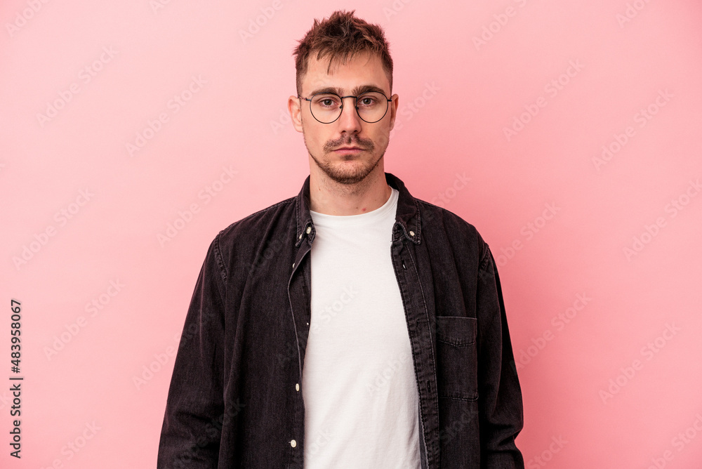 Young caucasian man isolated on pink background sad, serious face, feeling miserable and displeased. Young caucasian man isolated on pink background sad, serious face, feeling miserable and displeased.