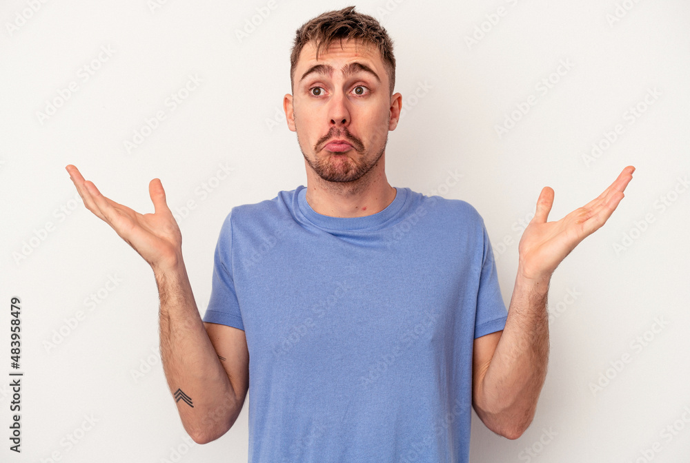 Young caucasian man isolated on white background pointing to the side Young caucasian man isolated on white background pointing to the side