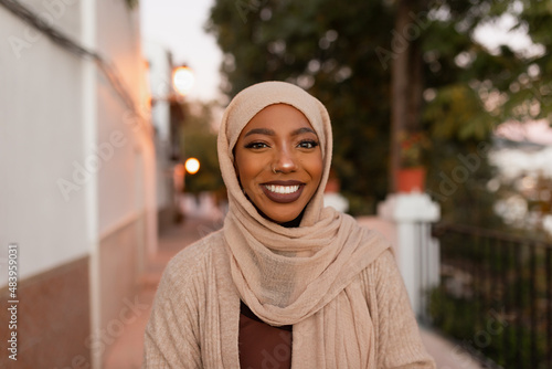 Happy muslim woman smiling at the camera outdoors photo