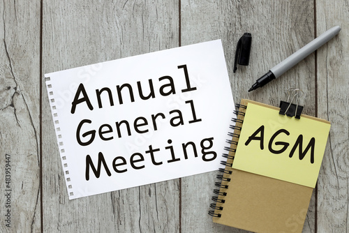 AGM symbol. Concept word 'AGM' - 'annual general meeting' Business and annual general meeting AGM concept, copy space.text on white paper photo