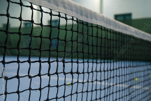 Empty blue tennis court. Tennis net and ball. © Anastasia