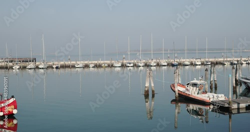 Chioggia town in venetian lagoon, water canal. Chioggia is a seaside town south of Venice, Italy. Traversed by the Corso del Popolo thoroughfare, its historic area has canals and narrow alleys.