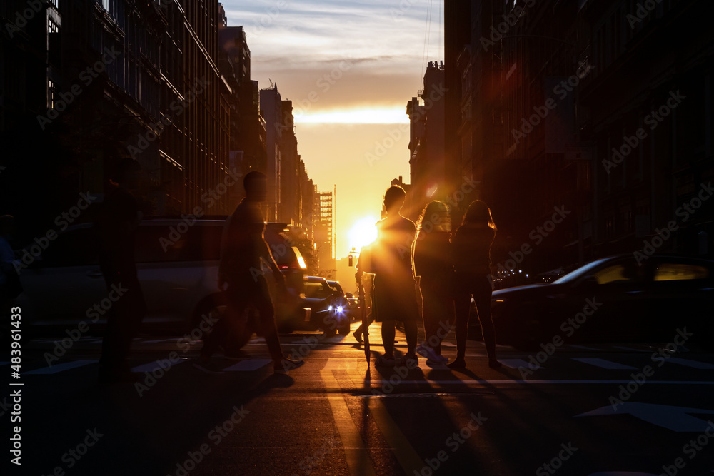 Busy street scene with crowds of people and cars in an intersection on ...