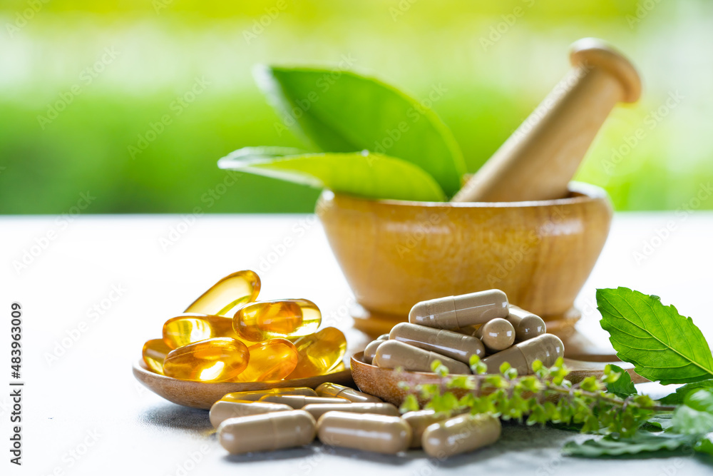 Alternative medicine herbal organic capsule with vitamin E omega 3 fish oil, mineral, drug with herbs leaf natural supplements for healthy good life. Alternative medicine herbal organic capsule with vitamin E omega 3 fish oil, mineral, drug with herbs leaf natural supplements for healthy good life.