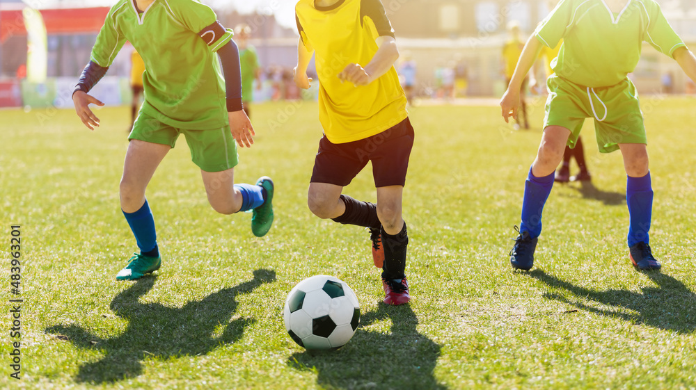 Obraz premium Football Game on Summer Sunny Day. Young Boys Compete in Tournament Match. School Kids Running Classic Soccer Ball on Grass Pitch