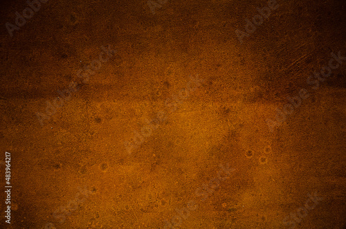 Rusty wall background. Natural rust is yellow-brown in color.