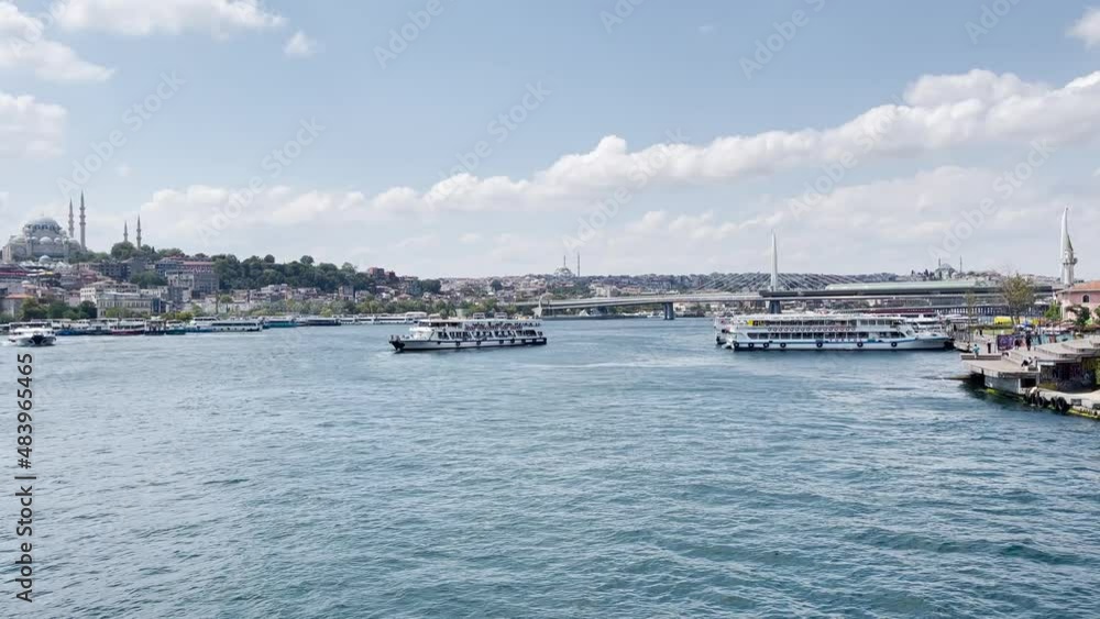 Many ferryboats sail on the Bosphorus river with Galata Bridge in the background in Istanbul Many ferryboats sail on the Bosphorus river with Galata Bridge in the background in Istanbul