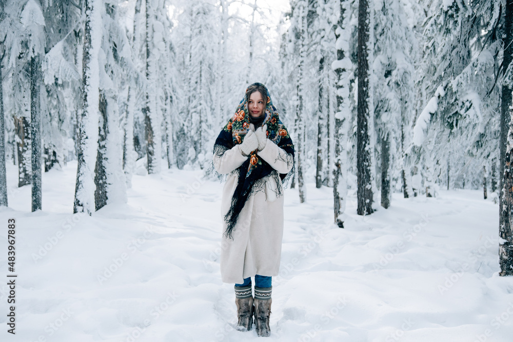Russian beautiful girl in winter forest Russian beautiful girl in winter forest