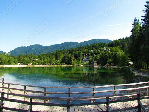 View of Lake Jasna near Kranjska Gora, Slovenia and a fenced wooden pathway in front