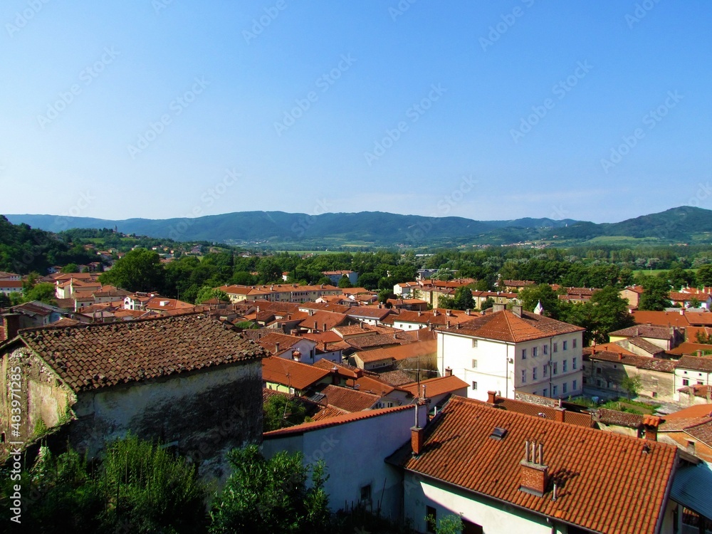 Beautiful view of a small town Vipava in Littoral region of Slovenia with red roofs and forest covered hills in the background