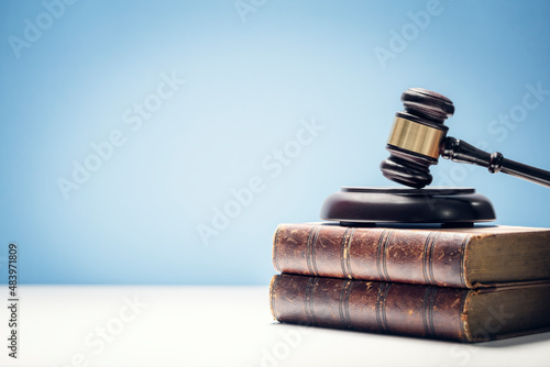 Wallpaper Mural Judge gavel and law books in court background with copy space