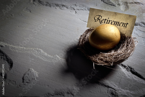 Retirement savings golden nest egg background photo