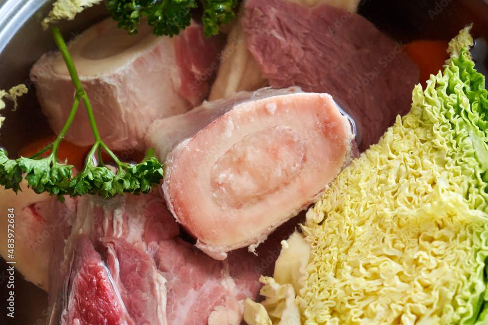 Marrow bones, vegetables and beef meat - preparation of homemade bone broth Marrow bones, vegetables and beef meat - preparation of homemade bone broth