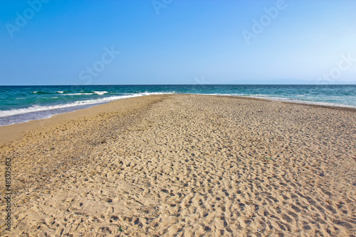 Detail from sandy Possidi cape beach in Greece
