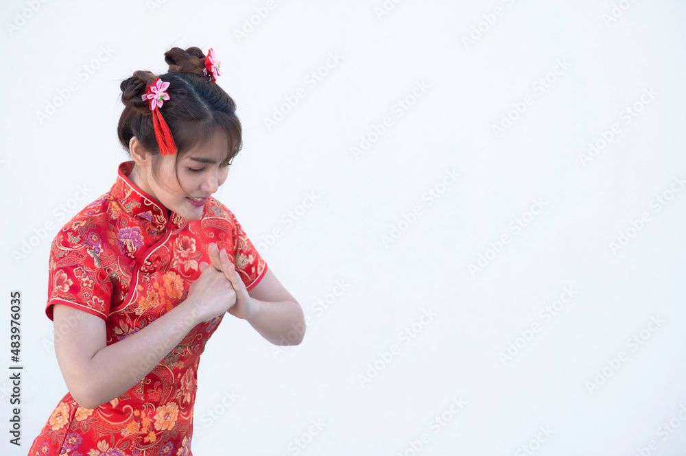 Portrait beautiful asian woman in Cheongsam dress on white background,Thailand people,Happy Chinese new year concept,Happy asian lady in chinese traditional dress Portrait beautiful asian woman in Cheongsam dress on white background,Thailand people,Happy Chinese new year concept,Happy asian lady in chinese traditional dress