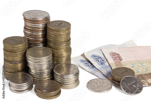 A stack of Russian coins and bills. Heap of money on white background.