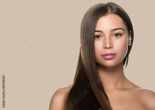 Smooth hair woman long hair beauty girl with pink lips. Color background. Brown.