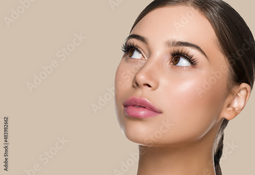 Papier peint Woman skin face with lashes beautiful eyes healthy hair brunette