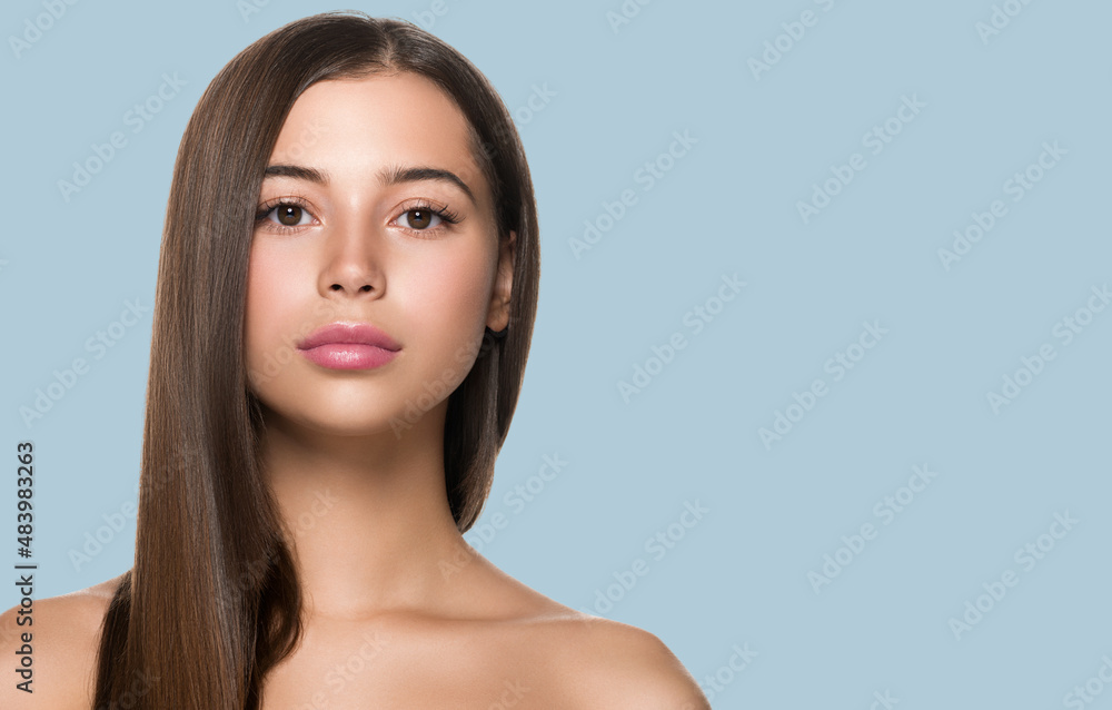 Smooth hair woman long hair beauty girl with pink lips. Color background. Blue Smooth hair woman long hair beauty girl with pink lips. Color background. Blue
