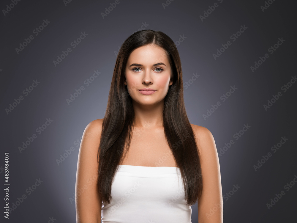 Obraz premium Natural brunette woman long hair casual makeup. Color background. Black