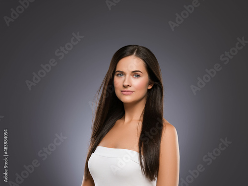 Natural brunette woman long hair casual makeup. Color background. Black