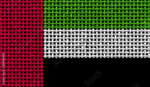   United Arab Emirates flag on the surface of a metal lattice. 3D image